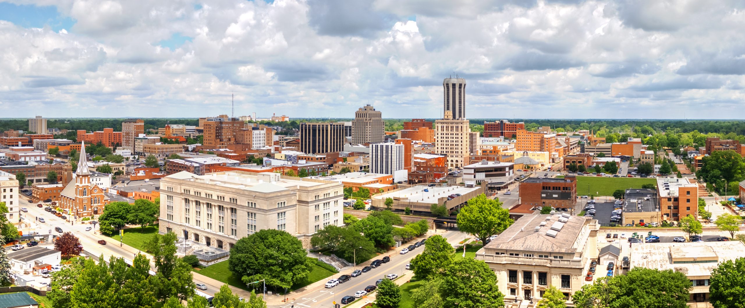 two people at work looking at a computer, text reads New Third-Party Administrator Starting June 2026