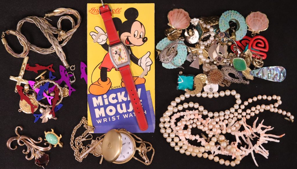 Mickey Mouse watch and other jewelry, including a pocket watch and necklaces for auction