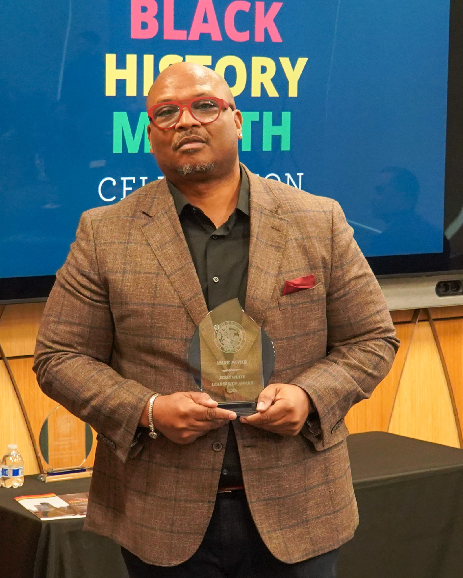 Mark Payne with award at Treasurer Frerichs' Black History Month Event