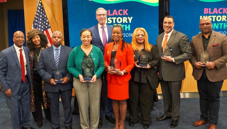 Treasurer Frerichs poses with recipients of Black HIstory Month Awards and with Jesse white