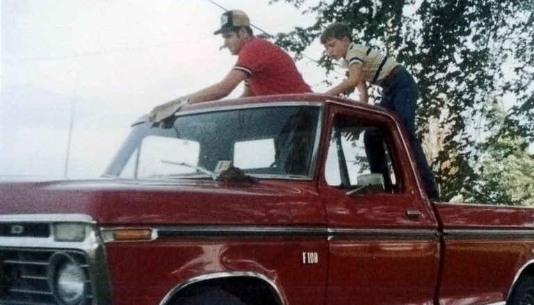 Treasurer Frerichs as a boy helping his dad wash and wax a red pickup truck