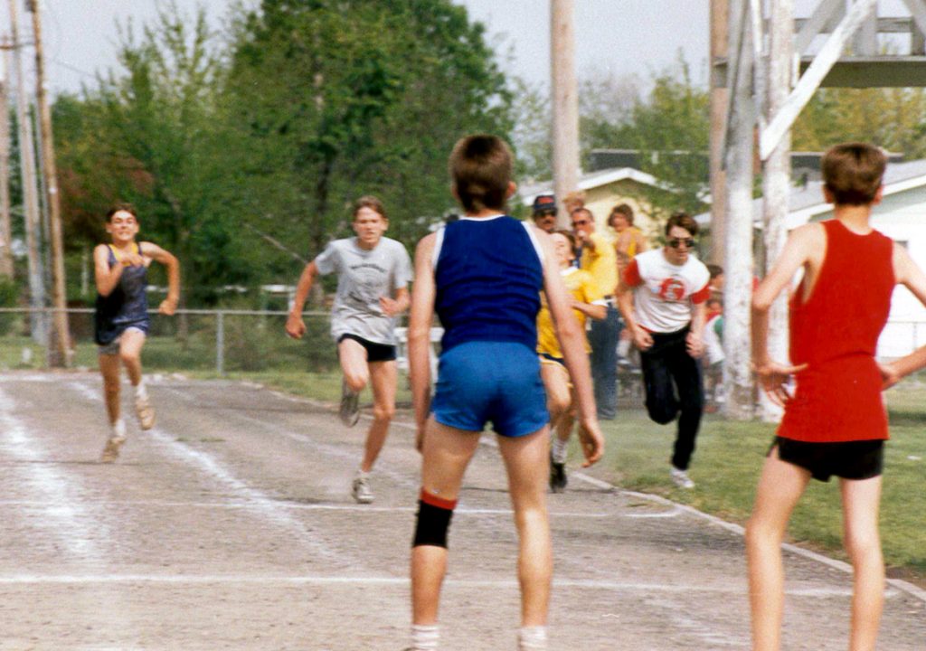 Treasurer Frerichs as a boy around age 12 running a race outside with other boys