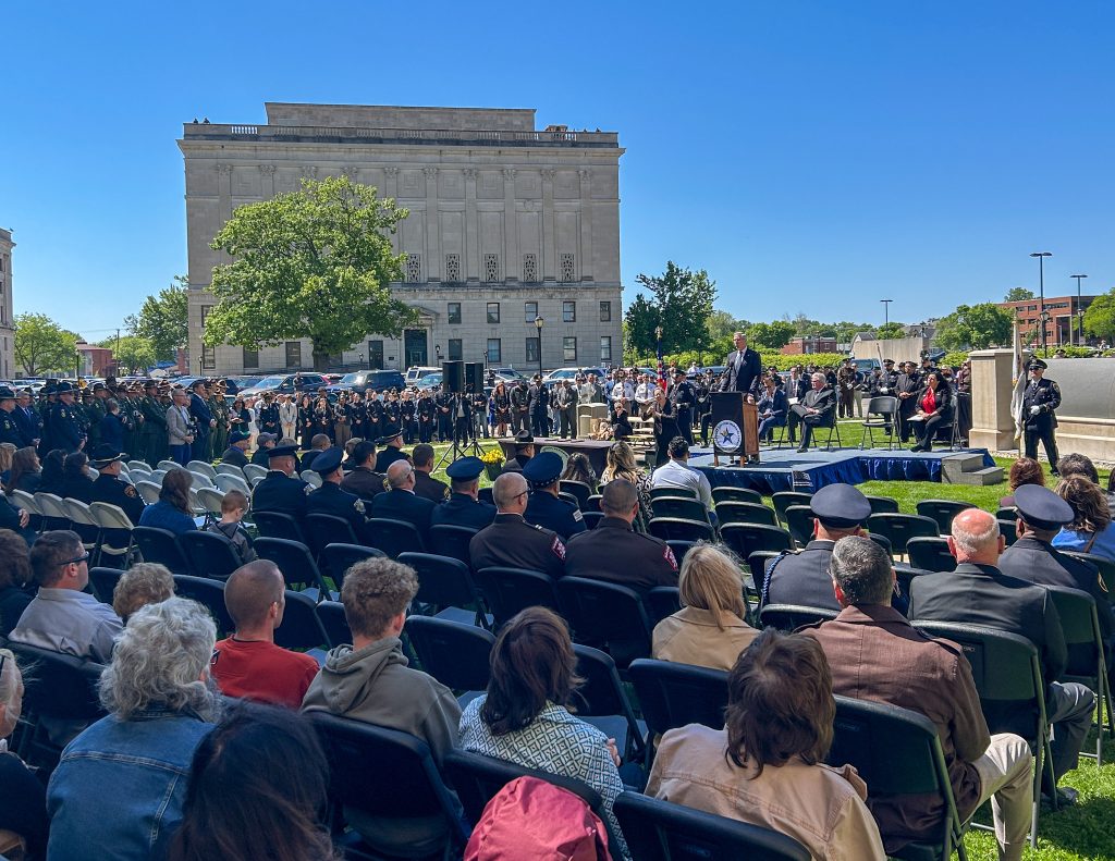 Treasurer Frerichs speaks to a large crowd outside at the Illinois Police Memorial. 