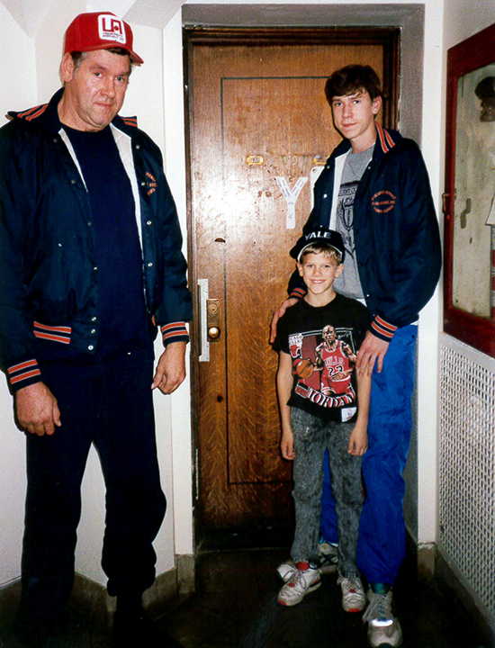 Treasurer Frerichs as a college student, standing in a room with his father and younger brother, who looks about 10 years old